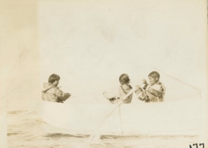 Image of Eskimos [Inuit] in dory, girl crew